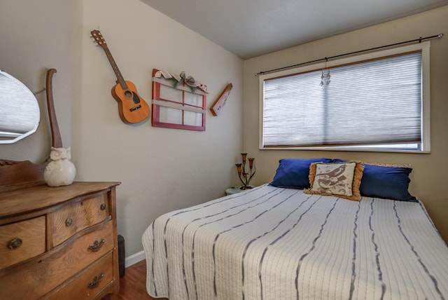 bedroom with hardwood / wood-style floors