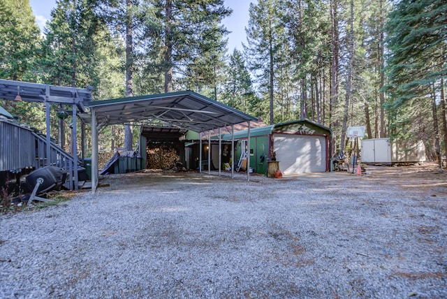 exterior space with a garage and a carport