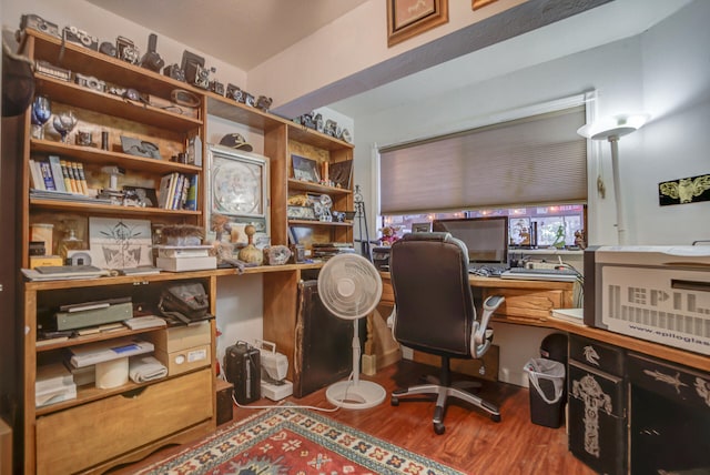 office with built in desk and wood-type flooring