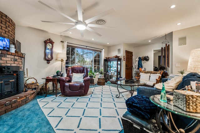 carpeted living room with ceiling fan