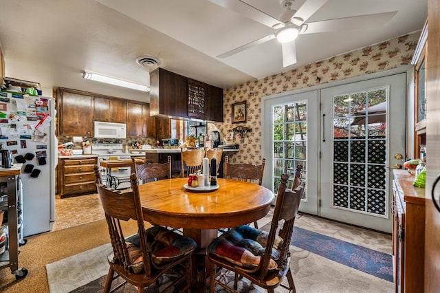 dining space featuring ceiling fan