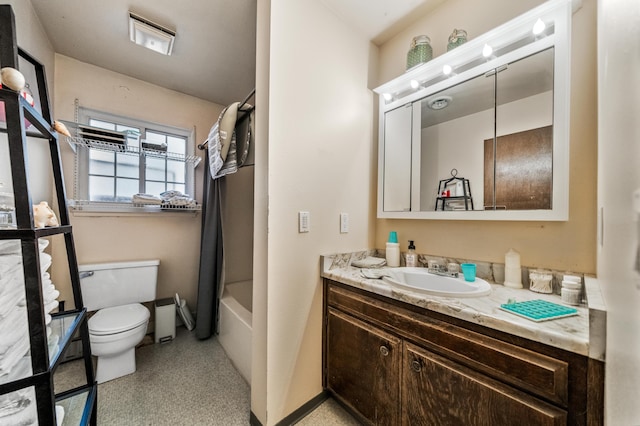 full bathroom with vanity, shower / bath combo, and toilet