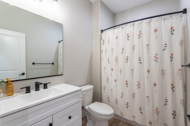 bathroom featuring toilet, a shower with curtain, vanity, and wood-type flooring