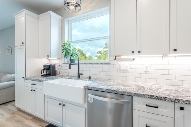 kitchen with dishwasher, sink, light wood-type flooring, white cabinetry, and tasteful backsplash