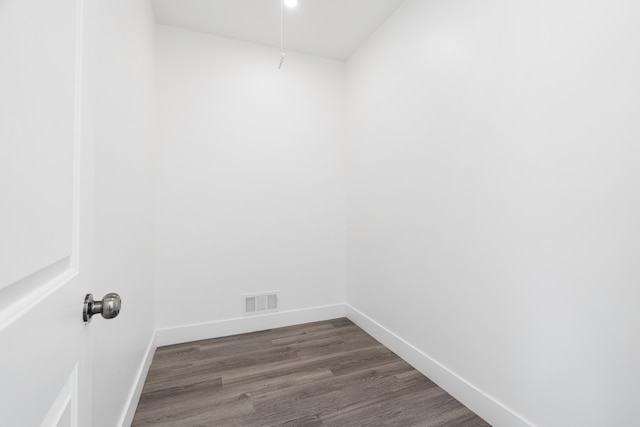 spare room with dark wood-type flooring