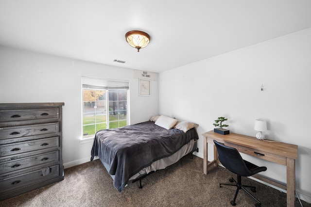 bedroom featuring dark carpet