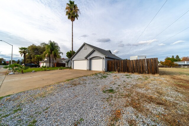 view of side of home with a garage