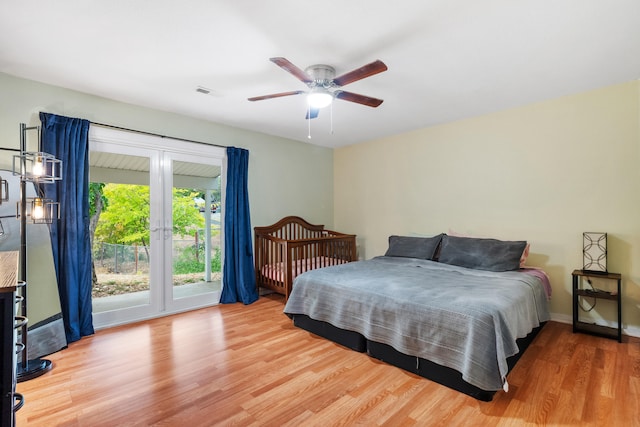 bedroom with light hardwood / wood-style flooring, access to exterior, and ceiling fan