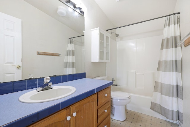 full bathroom with toilet, vanity, and shower / tub combo