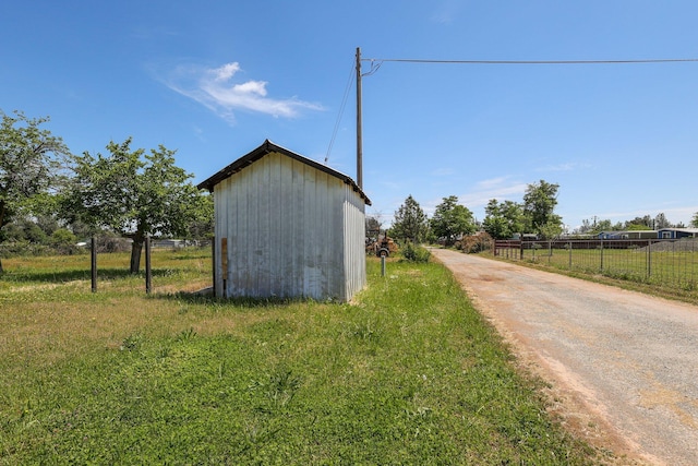 view of outdoor structure featuring a rural view