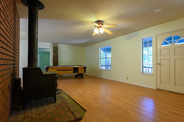 entryway featuring hardwood / wood-style floors, ceiling fan, billiards, and a textured ceiling