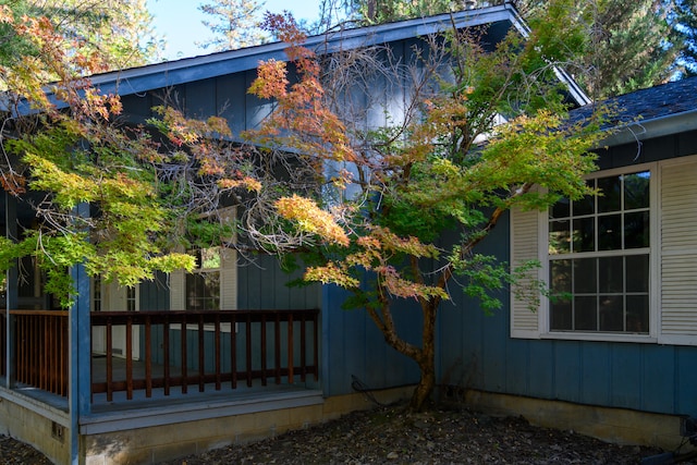 view of side of home with a wooden deck