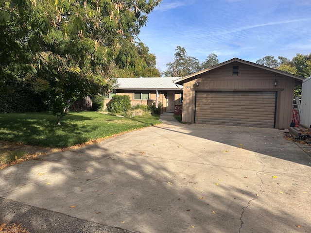 ranch-style house with a front yard and a garage