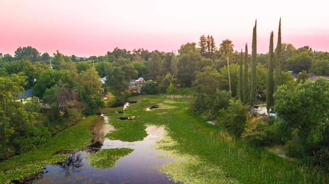 aerial view at dusk with a water view