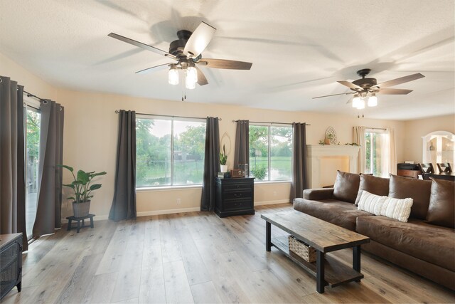 3182 Island Dr, Redding, CA 96001 - living area with a ceiling fan and light wood-style flooring
