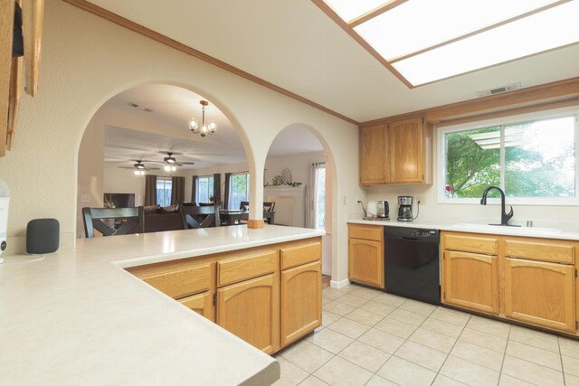 3182 Island Dr, Redding, CA 96001 - kitchen with dishwasher, arched walkways, light countertops, and crown molding