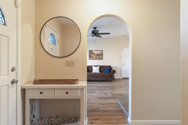 3182 Island Dr, Redding, CA 96001 - corridor with light wood-style floors and arched walkways