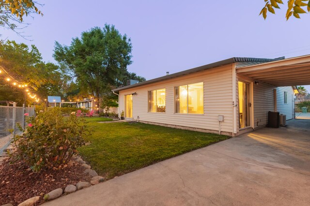 3182 Island Dr, Redding, CA 96001 - view of side of home with driveway and a carport