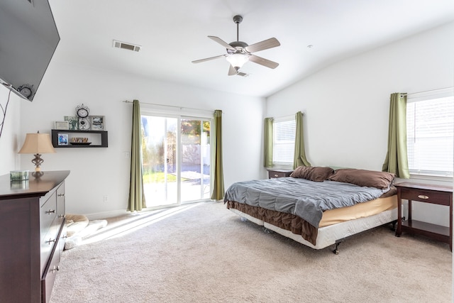 bedroom featuring access to exterior, light colored carpet, ceiling fan, and vaulted ceiling