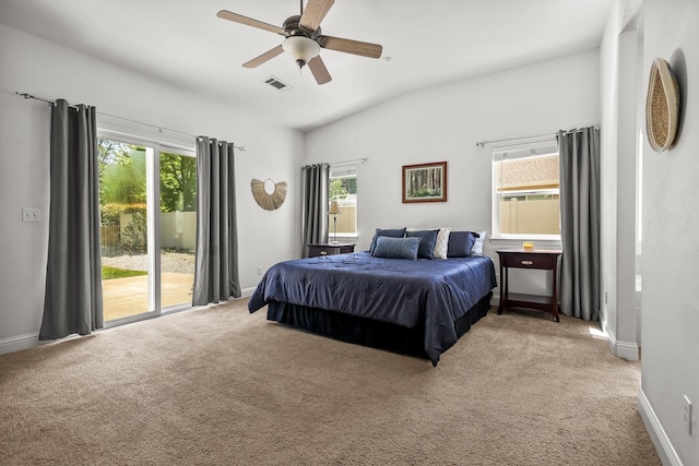 bedroom with light carpet, access to outside, and multiple windows
