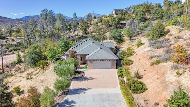 birds eye view of property featuring a mountain view