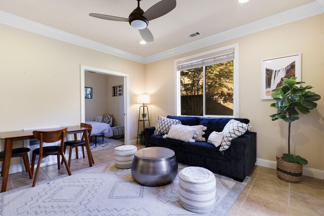 living room featuring ceiling fan and crown molding