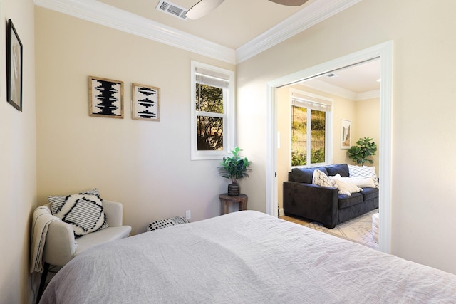 bedroom featuring ceiling fan and ornamental molding