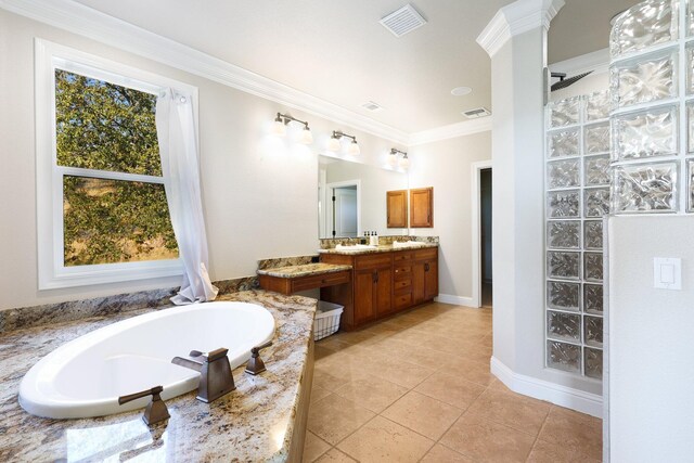 bathroom with a tub, tile patterned flooring, vanity, and ornamental molding