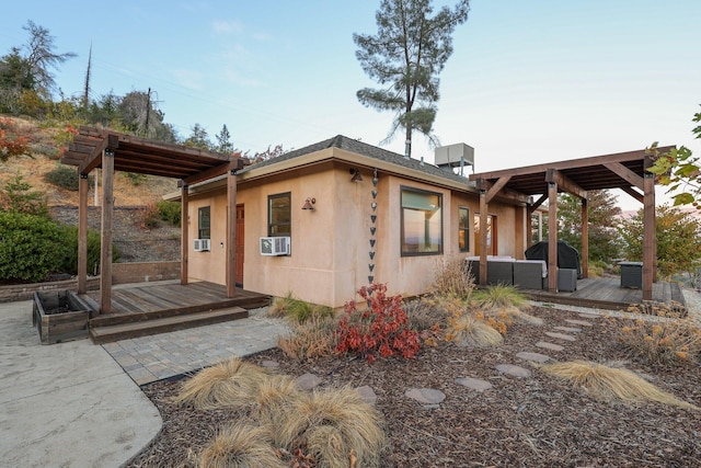 back of house with an outdoor hangout area, cooling unit, and a deck