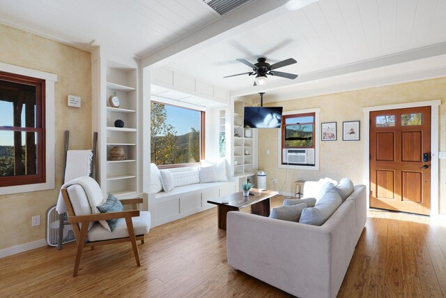 living room featuring cooling unit, ceiling fan, light wood-type flooring, built in features, and wood ceiling