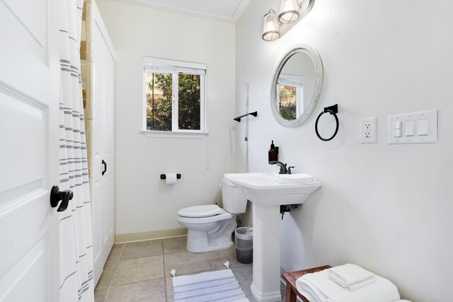 bathroom featuring tile patterned floors and toilet