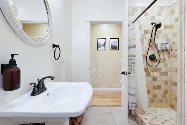 bathroom featuring sink, wood-type flooring, and a shower with shower curtain