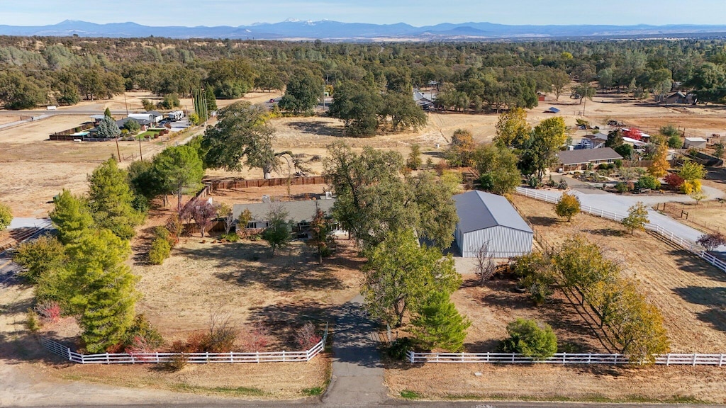 drone / aerial view featuring a mountain view and a rural view