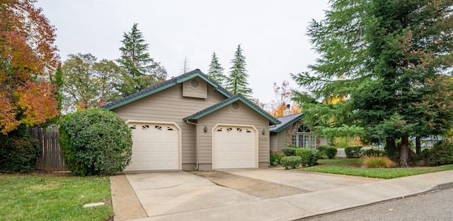 single story home featuring a garage