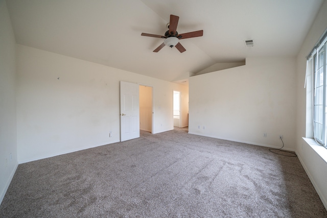 carpeted spare room with ceiling fan and lofted ceiling