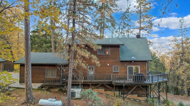 back of property featuring a deck