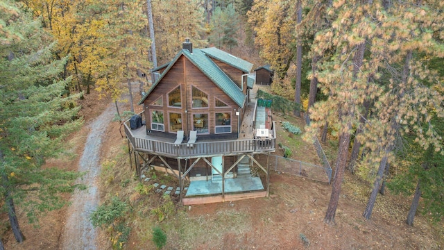 back of property with central AC unit, a patio, and a wooden deck