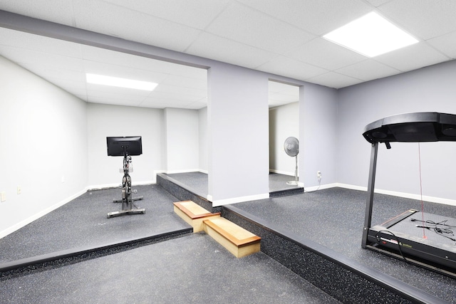 exercise area featuring a paneled ceiling