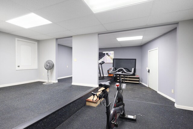 workout area with a paneled ceiling