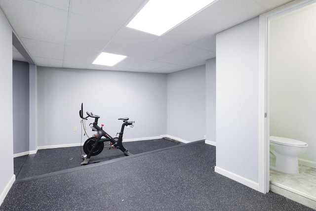 exercise room featuring a drop ceiling