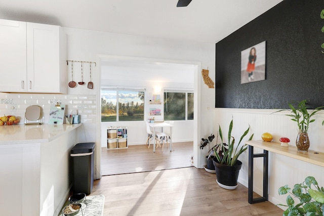 hall with light wood-type flooring