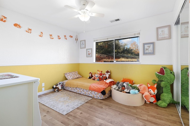 bedroom featuring ceiling fan and light wood-type flooring