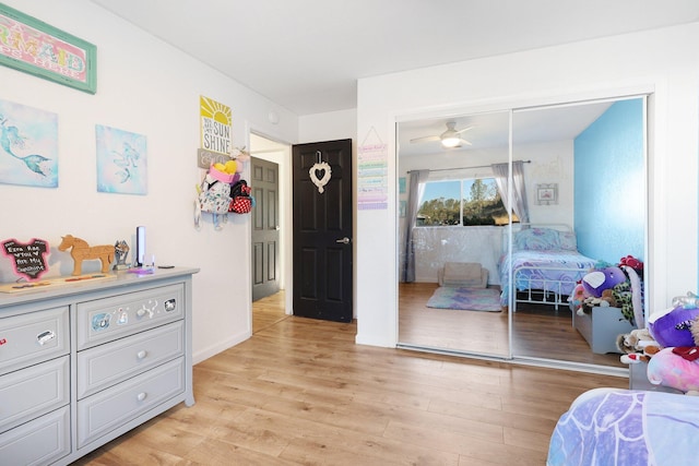 bedroom featuring light hardwood / wood-style floors and a closet