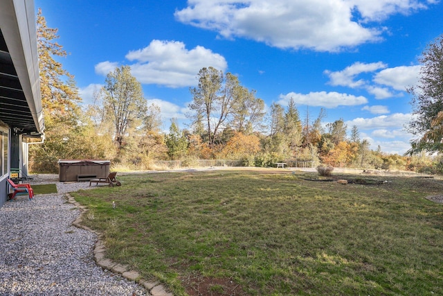 view of yard with a hot tub