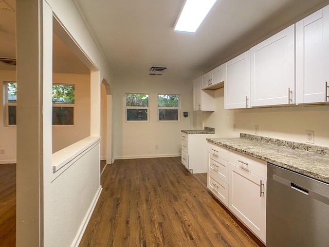 kitchen featuring dark wood-type flooring, white cabinetry, light stone counters, and dishwasher