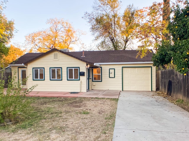 ranch-style home with a garage