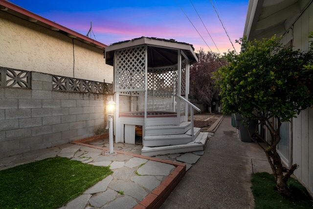 patio terrace at dusk with a gazebo