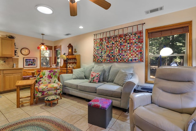 tiled living room featuring ceiling fan