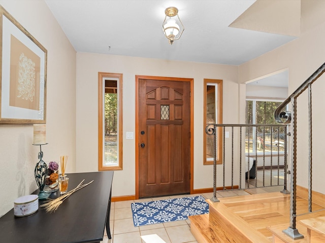 tiled entryway with a wealth of natural light