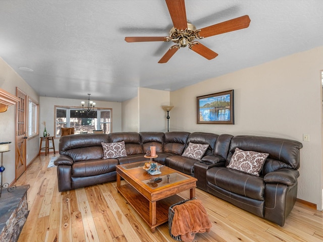 34820 Emigrant Trl, Shingletown, CA 96088 - living room featuring light wood-style flooring, a chandelier, and a ceiling fan
